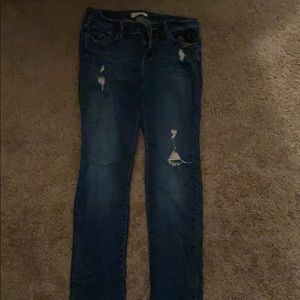 Straight leg dark wash ripped jeans